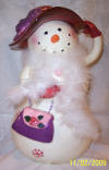 Snowgirl dressed up with fur cookie jar